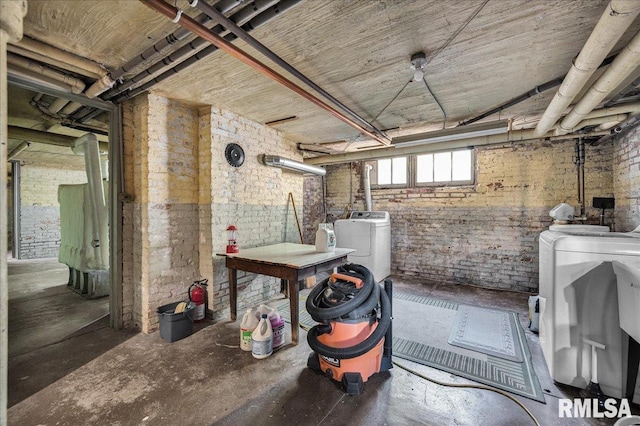 1027 N Maplewood Ave, Peoria, IL 61606 - below grade area with washing machine and clothes dryer and brick wall