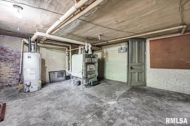 1027 N Maplewood Ave, Peoria, IL 61606 - unfinished basement featuring water heater, brick wall, and heating unit