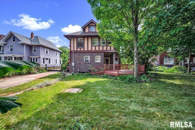 1027 N Maplewood Ave, Peoria, IL 61606 - rear view of property with a wooden deck, a lawn, and brick siding