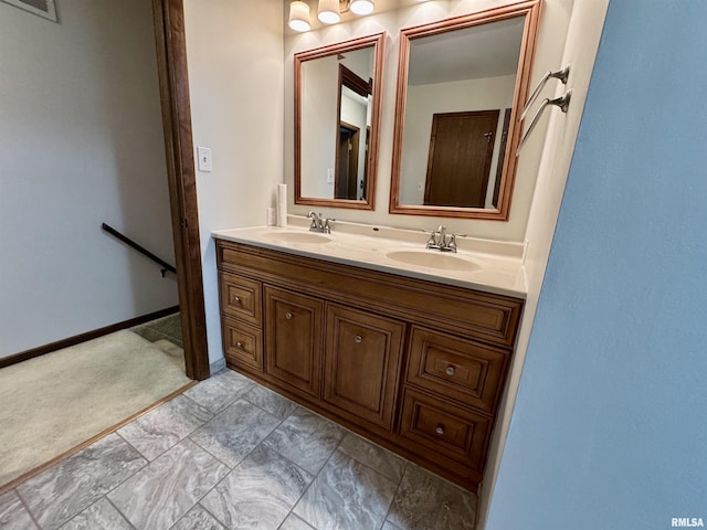 2001 W Jackson St Unit C, Macomb, IL 61455 - bathroom featuring double vanity and baseboards