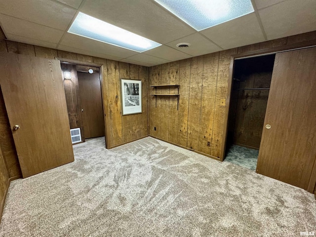 2001 W Jackson St Unit C, Macomb, IL 61455 - carpeted spare room with a paneled ceiling and wood walls