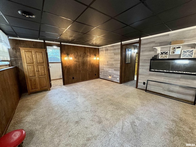 2001 W Jackson St Unit C, Macomb, IL 61455 - unfurnished living room featuring wood walls, carpet, and a drop ceiling