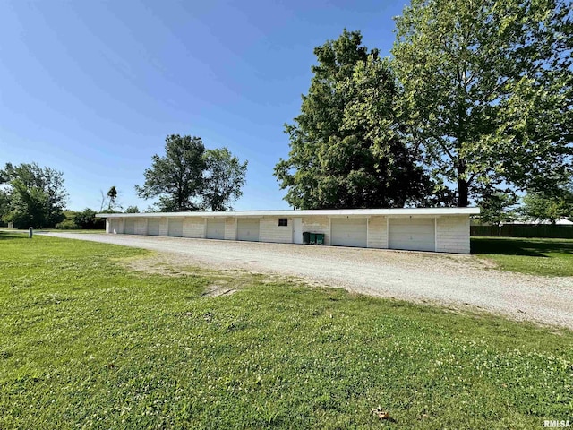 2001 W Jackson St Unit C, Macomb, IL 61455 - view of front facade with a front yard and a garage