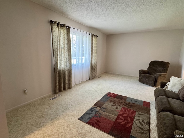 2001 W Jackson St Unit C, Macomb, IL 61455 - living room with carpet flooring and a textured ceiling