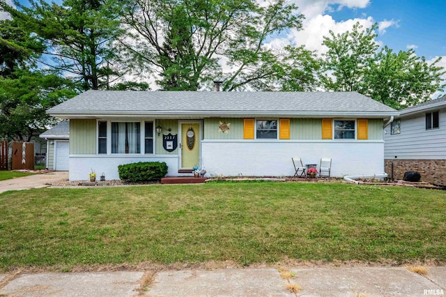 2227 W Westport Rd, Peoria, IL 61615 - ranch-style home featuring brick siding, a front yard, driveway, and roof with shingles