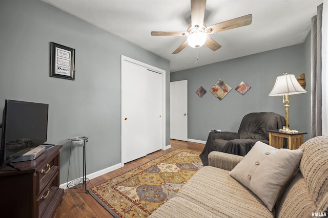 2227 W Westport Rd, Peoria, IL 61615 - living area with a ceiling fan and wood finished floors
