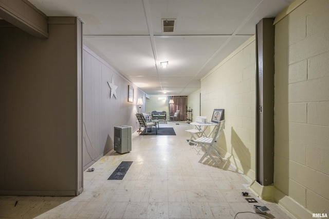 2227 W Westport Rd, Peoria, IL 61615 - hall featuring tile patterned floors and concrete block wall