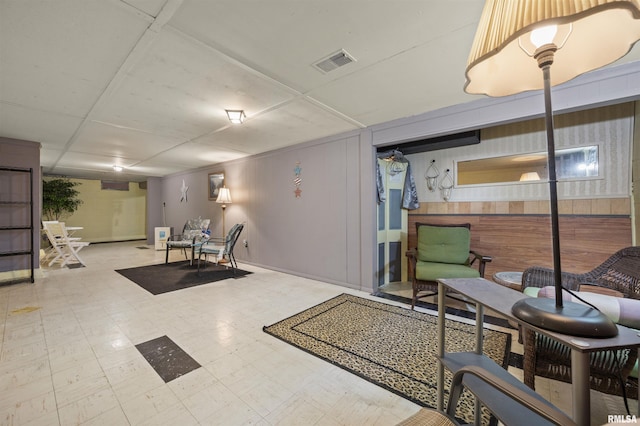 2227 W Westport Rd, Peoria, IL 61615 - finished basement featuring tile patterned floors and wooden walls