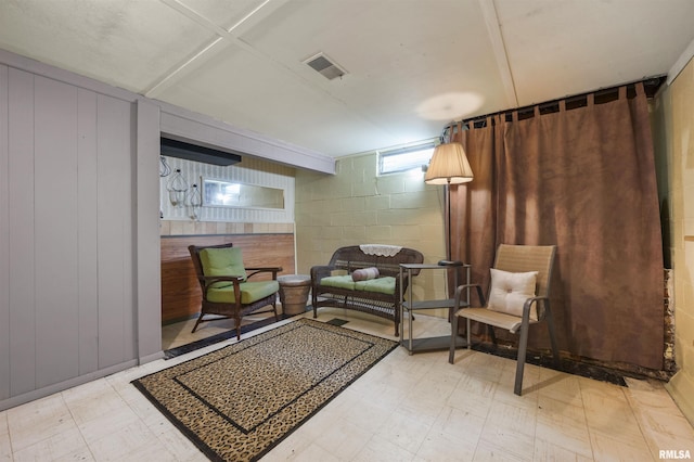 2227 W Westport Rd, Peoria, IL 61615 - living area featuring light floors and concrete block wall