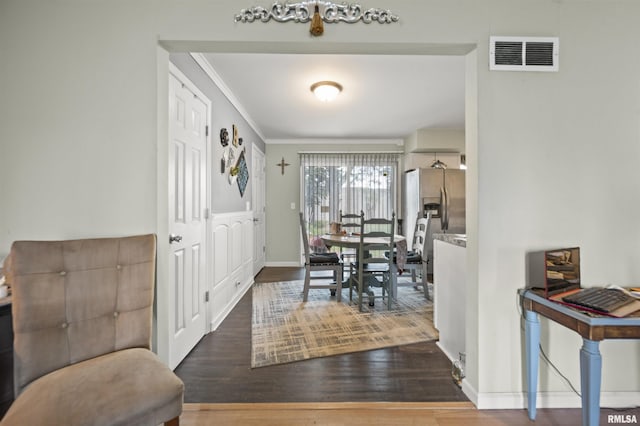 2227 W Westport Rd, Peoria, IL 61615 - dining room featuring wood finished floors and crown molding