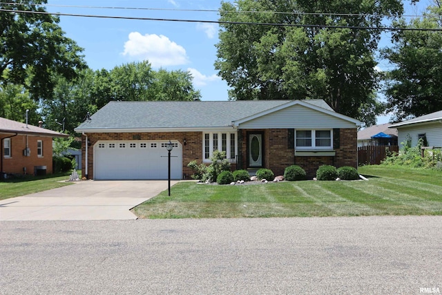 307 N Toepfer St, Tremont, IL 61568 - single story home featuring brick siding, a garage, driveway, and roof with shingles