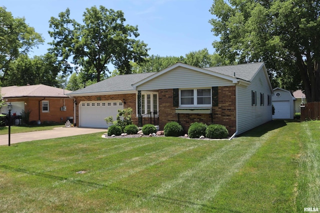 307 N Toepfer St, Tremont, IL 61568 - ranch-style home with brick siding, concrete driveway, a front yard, and a garage