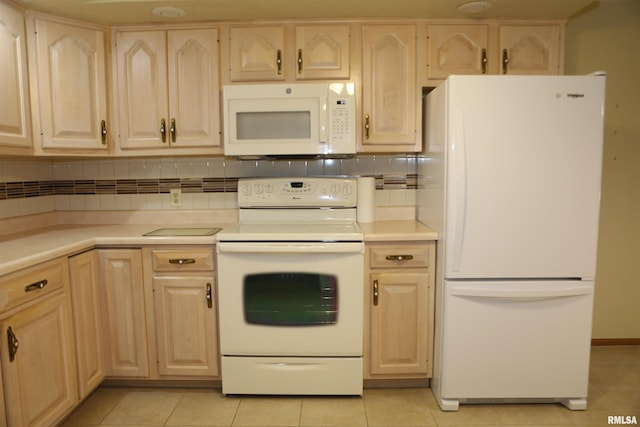 307 N Toepfer St, Tremont, IL 61568 - kitchen with white appliances, light brown cabinetry, light countertops, and light tile patterned flooring