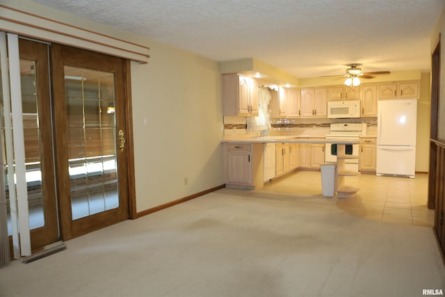 307 N Toepfer St, Tremont, IL 61568 - kitchen featuring white appliances, light countertops, light carpet, a ceiling fan, and a textured ceiling