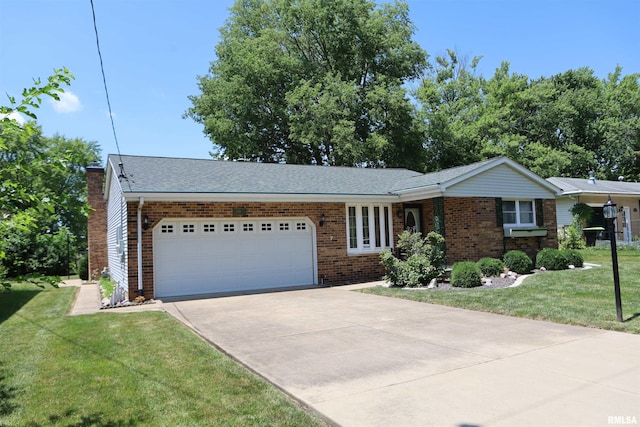 307 N Toepfer St, Tremont, IL 61568 - ranch-style house with an attached garage, concrete driveway, brick siding, a front lawn, and a chimney