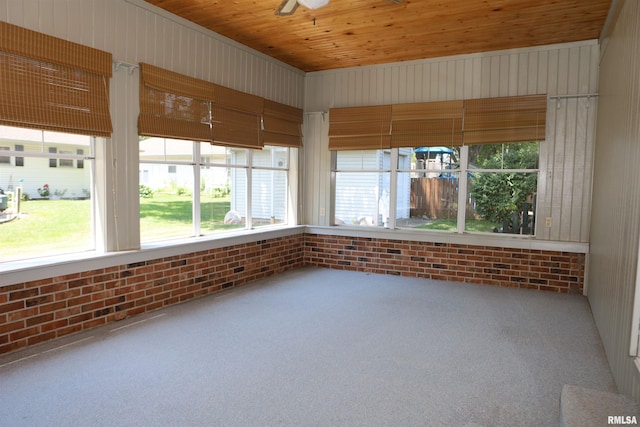 307 N Toepfer St, Tremont, IL 61568 - unfurnished sunroom with brick wall and carpet