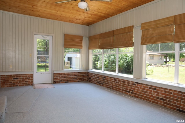 307 N Toepfer St, Tremont, IL 61568 - unfurnished sunroom featuring a ceiling fan, brick wall, carpet, and healthy amount of natural light