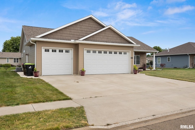 109 E Lee St, Tremont, IL 61568 - view of front of property featuring driveway, a front yard, and an attached garage
