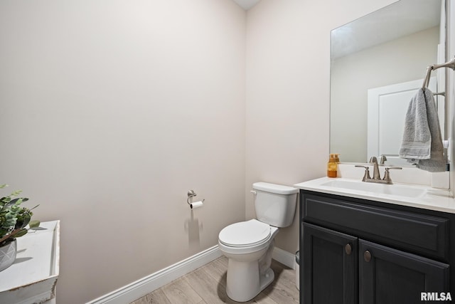 109 E Lee St, Tremont, IL 61568 - bathroom featuring vanity and wood finished floors
