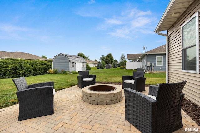 109 E Lee St, Tremont, IL 61568 - view of patio / terrace featuring an outdoor fire pit and an outbuilding