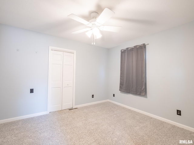 6334 Macs Rd, Manito, IL 61546 - unfurnished bedroom featuring carpet, a closet, and ceiling fan