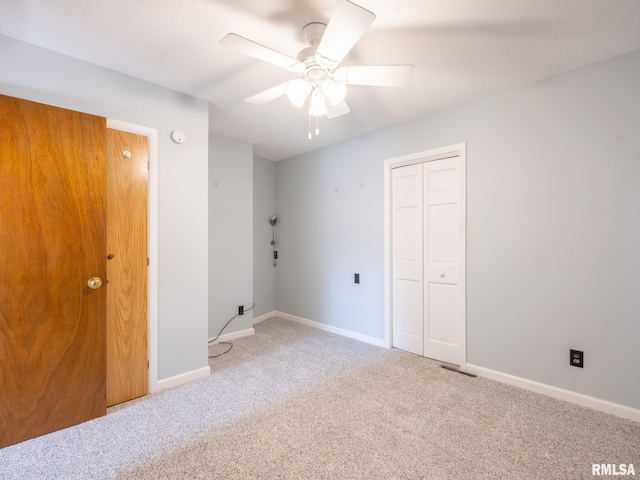 6334 Macs Rd, Manito, IL 61546 - unfurnished bedroom featuring carpet, a closet, and ceiling fan
