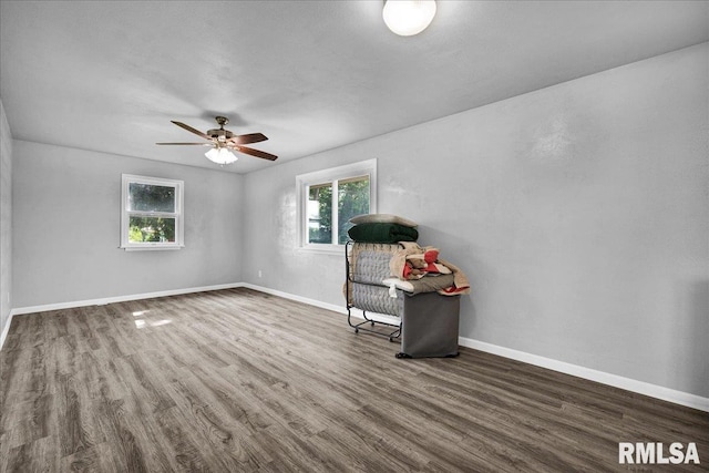 14100 Glasford-Canton Rd, Glasford, IL 61533 - unfurnished room featuring healthy amount of natural light, wood finished floors, and ceiling fan