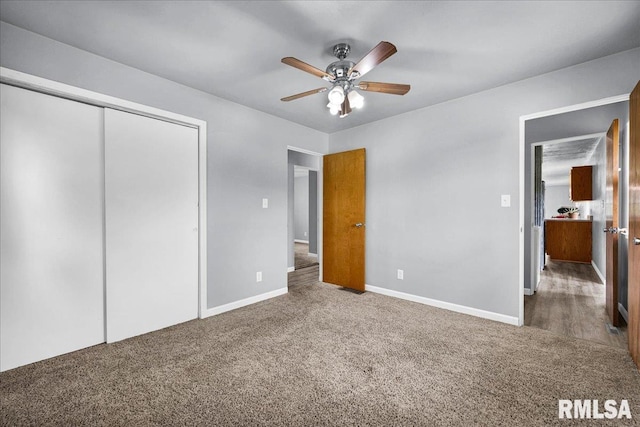 14100 Glasford-Canton Rd, Glasford, IL 61533 - unfurnished bedroom featuring carpet, a closet, and a ceiling fan