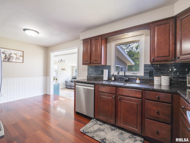 1100 Hampton Rd, Washington, IL 61571 - kitchen featuring dishwasher, wood finished floors, decorative backsplash, wainscoting, and dark stone countertops