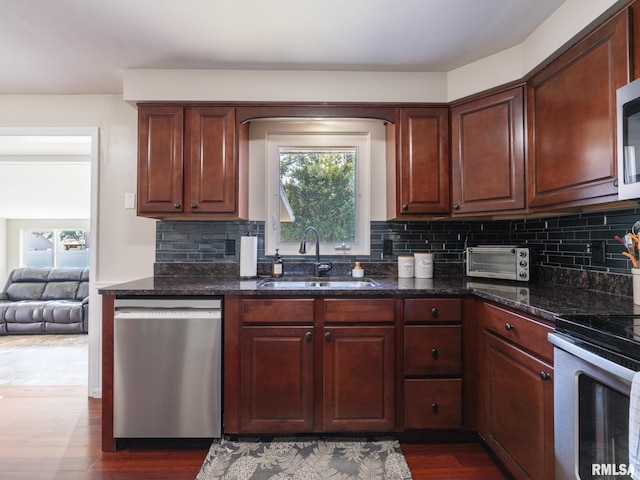1100 Hampton Rd, Washington, IL 61571 - kitchen with stainless steel appliances, dark wood-type flooring, and backsplash