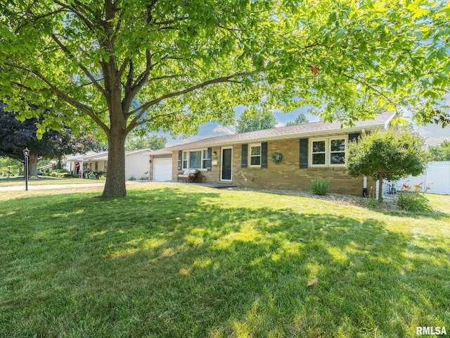 1100 Hampton Rd, Washington, IL 61571 - ranch-style home with a garage, brick siding, and driveway