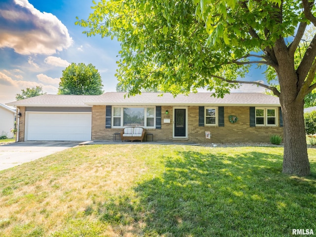 1100 Hampton Rd, Washington, IL 61571 - single story home with brick siding, concrete driveway, an attached garage, and a front lawn