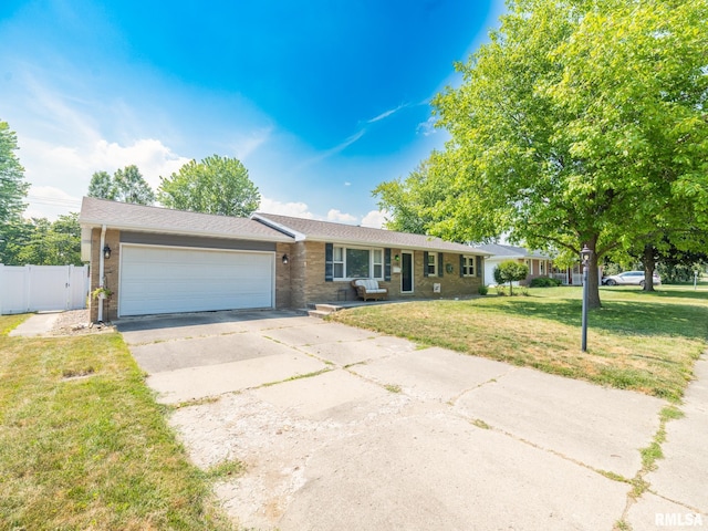 1100 Hampton Rd, Washington, IL 61571 - single story home with driveway, brick siding, and an attached garage