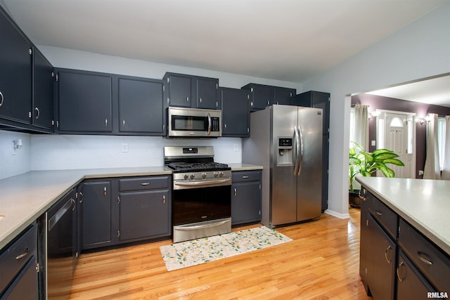 499 Goodsill Dr, East Galesburg, IL 61430 - kitchen featuring stainless steel appliances, light wood finished floors, light countertops, and tasteful backsplash
