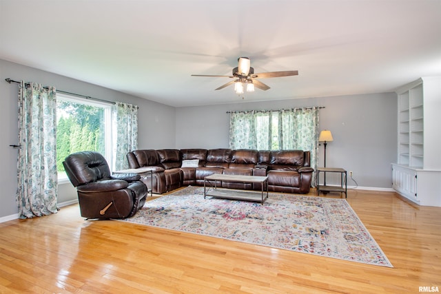 499 Goodsill Dr, East Galesburg, IL 61430 - living area featuring wood finished floors and a ceiling fan