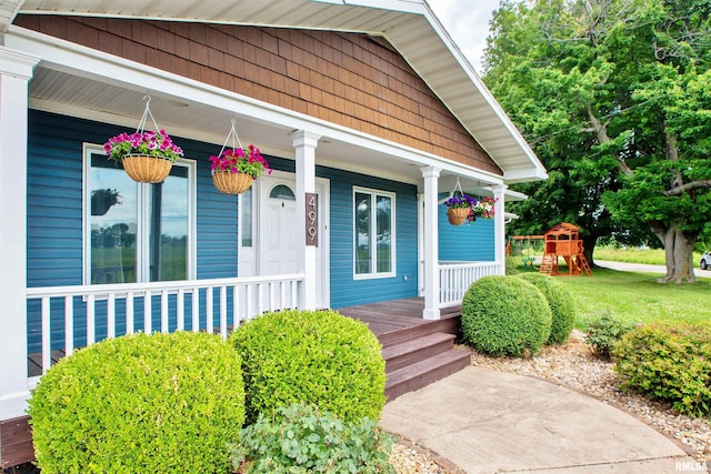 499 Goodsill Dr, East Galesburg, IL 61430 - property entrance featuring covered porch and a lawn