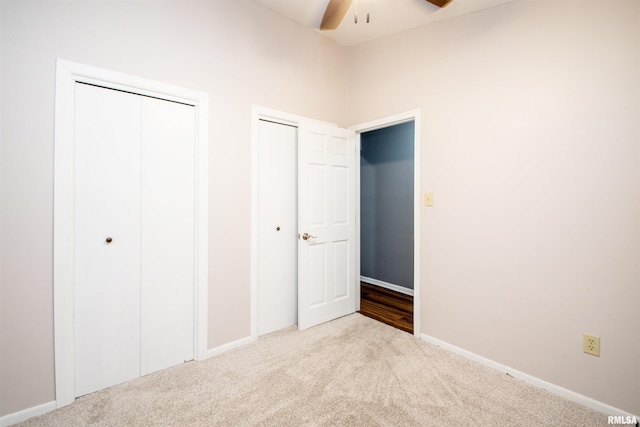 499 Goodsill Dr, East Galesburg, IL 61430 - unfurnished bedroom featuring carpet and two closets