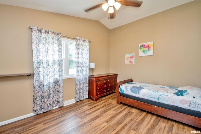499 Goodsill Dr, East Galesburg, IL 61430 - bedroom featuring wood finished floors, lofted ceiling, and a ceiling fan