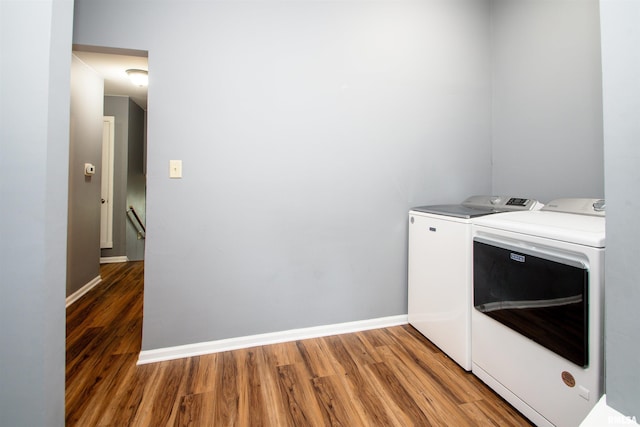 499 Goodsill Dr, East Galesburg, IL 61430 - laundry area with washing machine and dryer and wood finished floors