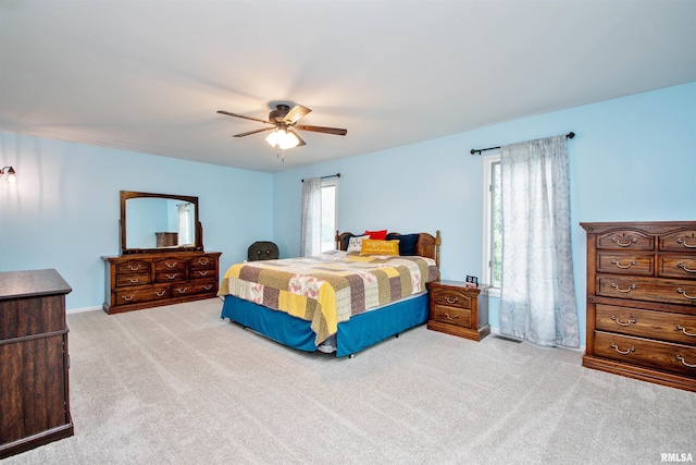 499 Goodsill Dr, East Galesburg, IL 61430 - bedroom featuring light carpet and a ceiling fan