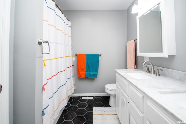 499 Goodsill Dr, East Galesburg, IL 61430 - bathroom featuring double vanity, tile patterned floors, and a shower with shower curtain