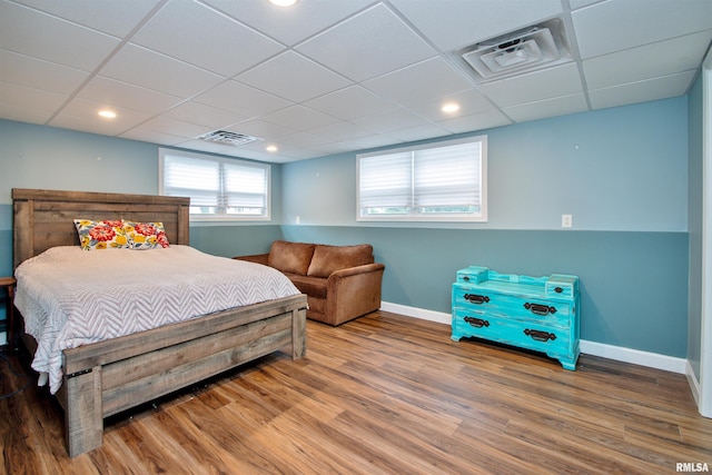 499 Goodsill Dr, East Galesburg, IL 61430 - bedroom featuring wood finished floors and a paneled ceiling