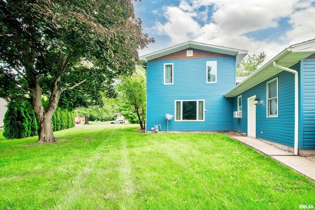 499 Goodsill Dr, East Galesburg, IL 61430 - back of property featuring a yard and cooling unit