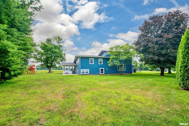 499 Goodsill Dr, East Galesburg, IL 61430 - back of property featuring a yard