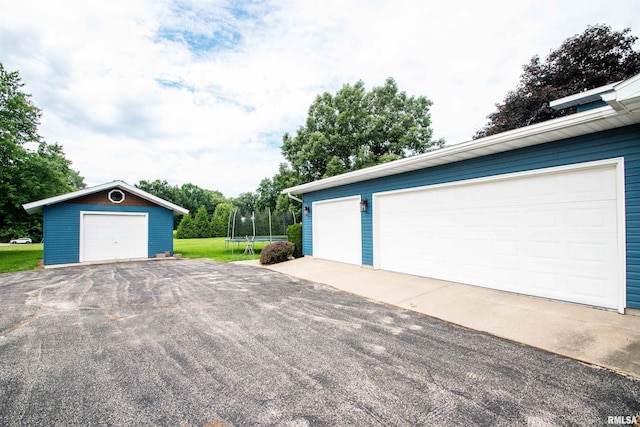 499 Goodsill Dr, East Galesburg, IL 61430 - detached garage featuring a trampoline