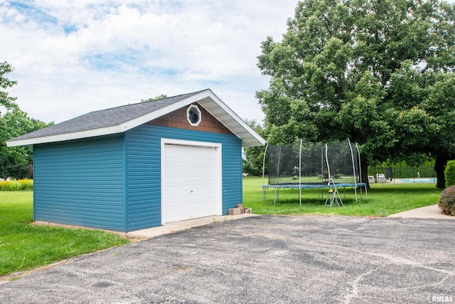 499 Goodsill Dr, East Galesburg, IL 61430 - detached garage with a trampoline and driveway