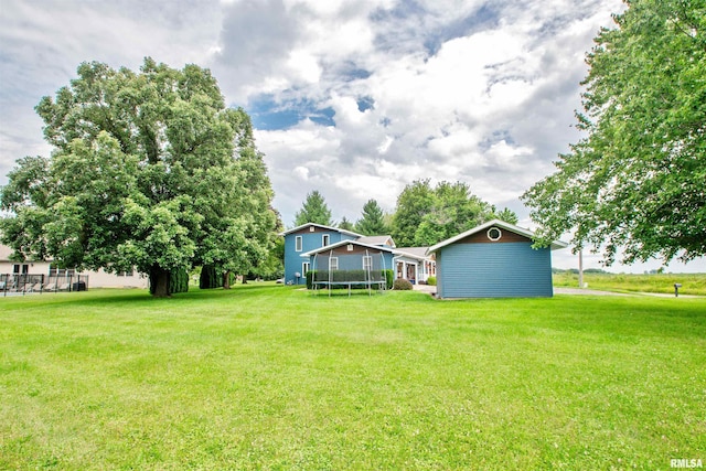 499 Goodsill Dr, East Galesburg, IL 61430 - view of grassy yard with a trampoline
