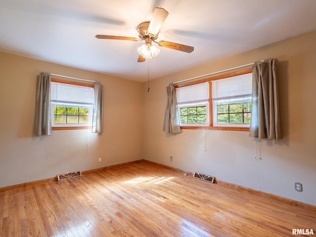 204 Ivanhoe Way, Bloomington, IL 61701 - unfurnished room featuring light wood finished floors and a ceiling fan