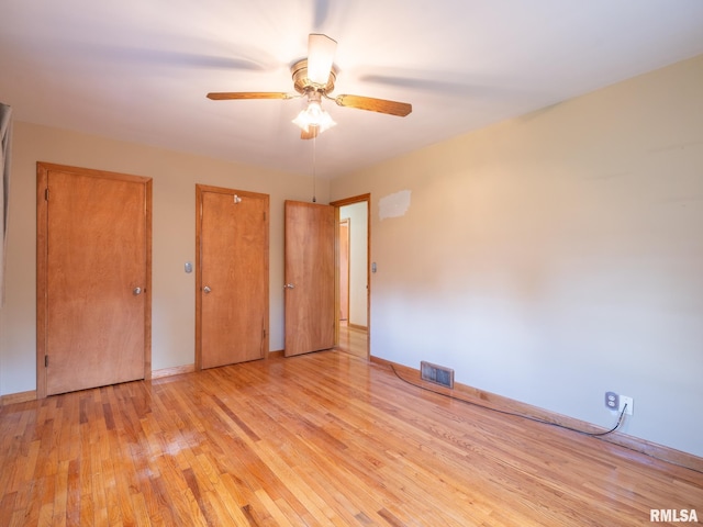 204 Ivanhoe Way, Bloomington, IL 61701 - unfurnished bedroom featuring wood finished floors and ceiling fan