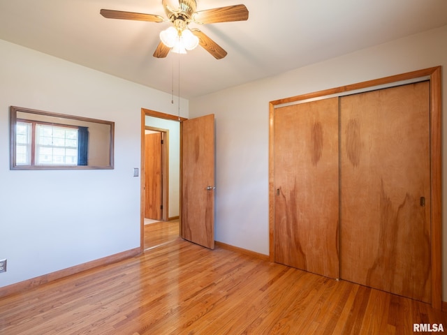 204 Ivanhoe Way, Bloomington, IL 61701 - unfurnished bedroom featuring light wood-style floors, a closet, and ceiling fan